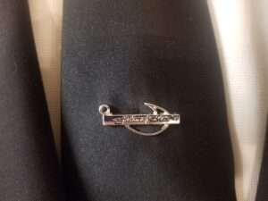 Fishers on men silver pin on black suit